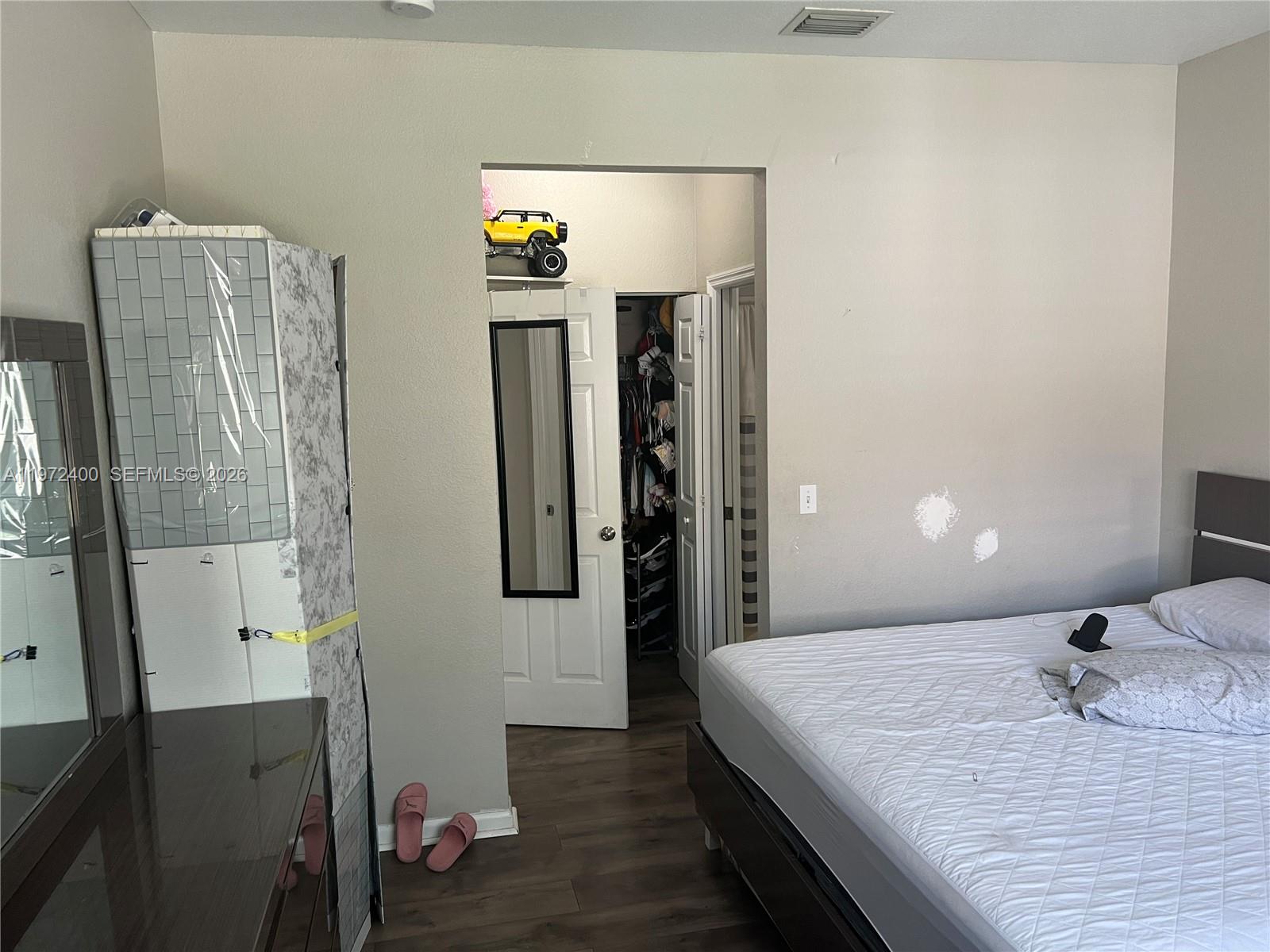 95 Southwest 15th Road Homestead, FL 33030 - Photo 15 of 42 a en suite bathroom with a granite countertop sink and a mirror