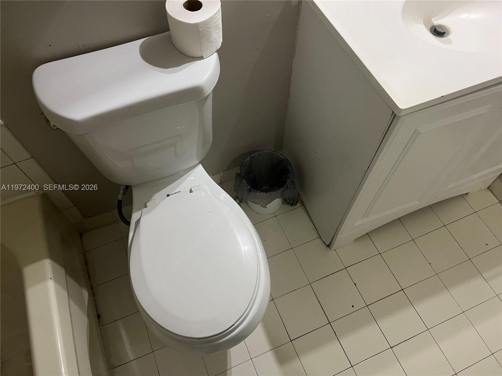 95 Southwest 15th Road Homestead, FL 33030 - Photo 22 of 42 a bathroom with a toilet and a mirror