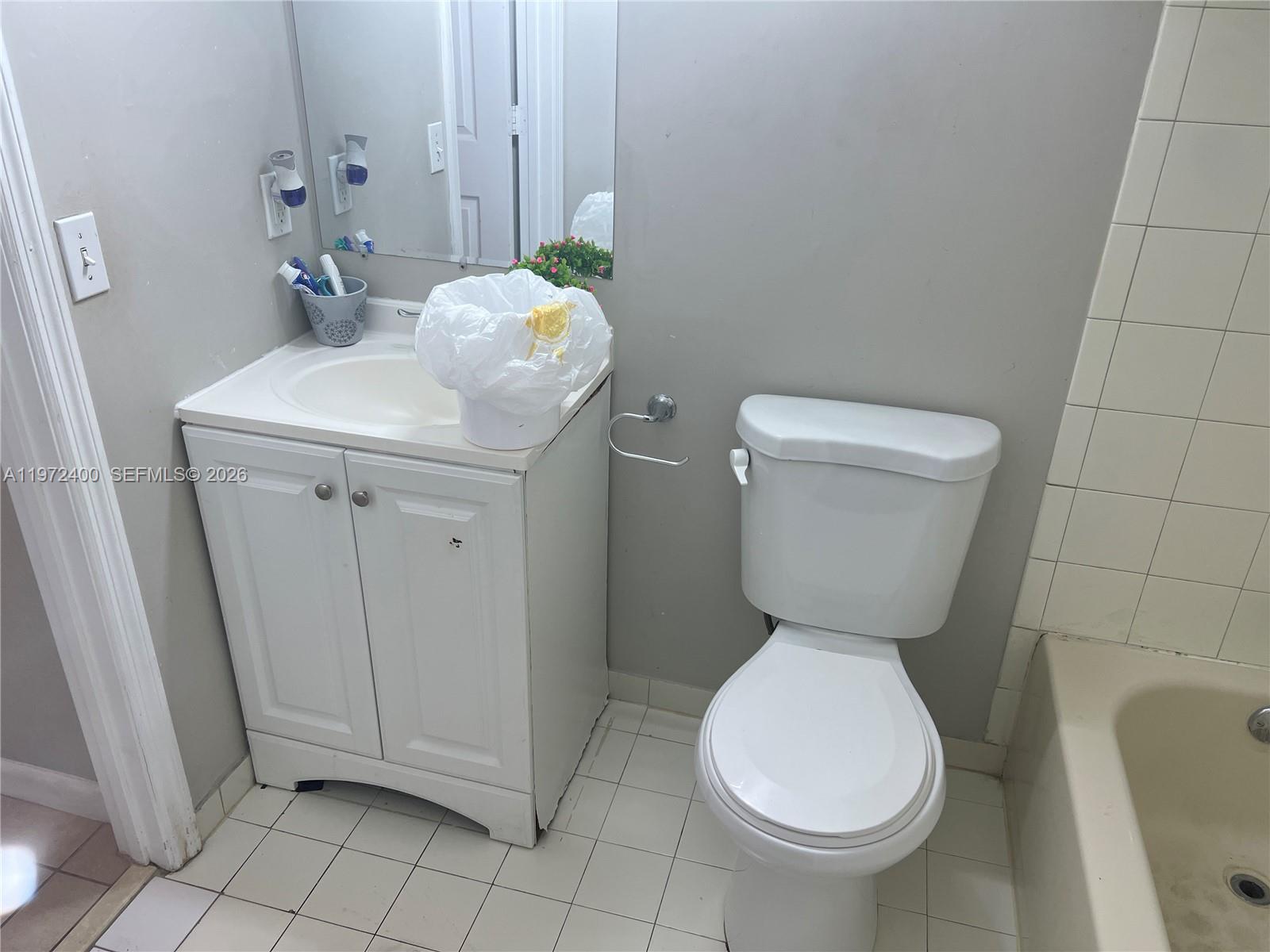 95 Southwest 15th Road Homestead, FL 33030 - Photo 27 of 42 a bathroom with a toilet and a sink