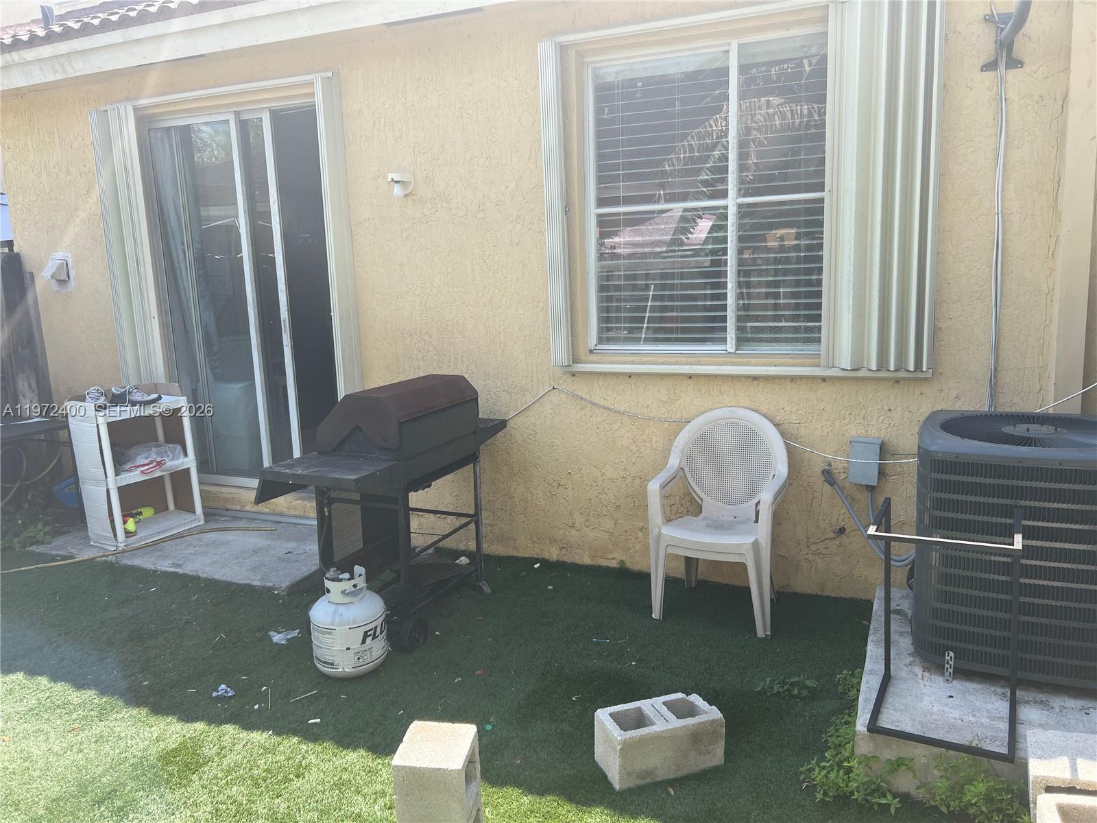 95 Southwest 15th Road Homestead, FL 33030 - Photo 41 of 42 a living room with furniture and a window