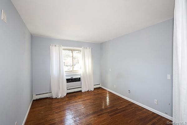 2449 Union Boulevard, Unit 24A Islip, NY 11751 - Photo 11 of 16 a view of an empty room with wooden floor closet and windows