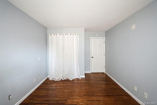 2449 Union Boulevard, Unit 24A Islip, NY 11751 - Photo 13 of 16 a view of room with window and hardwood floor