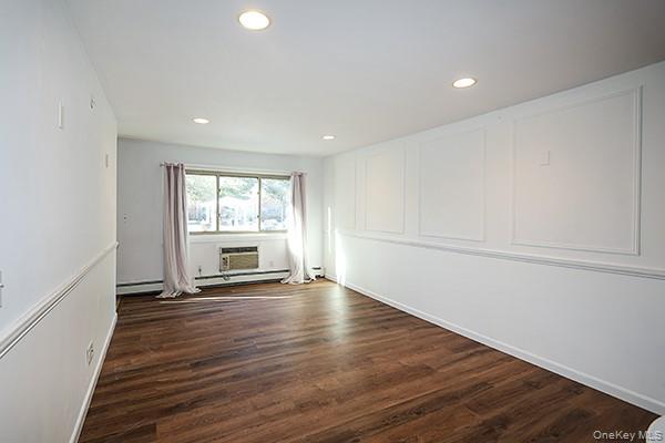 2449 Union Boulevard, Unit 24A Islip, NY 11751 - Photo 7 of 16 a view of empty room with wooden floor and fan