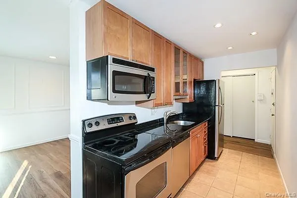 a kitchen with a stove and a microwave