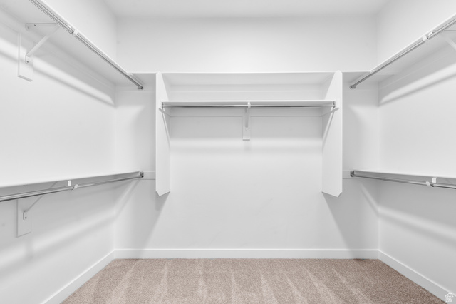 1869 South 2425 West Ogden, UT 84401 - Photo 21 of 22 Walk in closet featuring light carpet