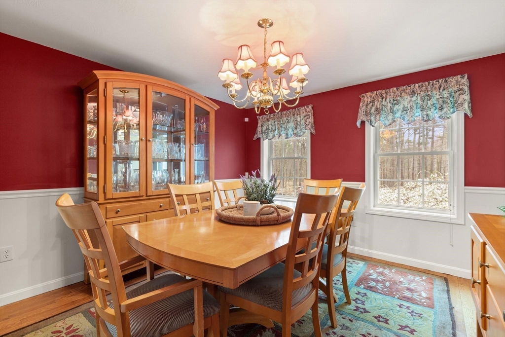 41 Chestnut Road Tyngsborough, MA 01879 - Photo 7 of 32 a view of a dining room with furniture a chandelier and wooden floor