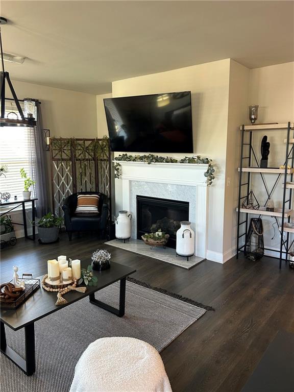 5860 Stargazer Way Cumming, GA 30028 - Photo 15 of 36 a living room with furniture flat screen tv and a fireplace
