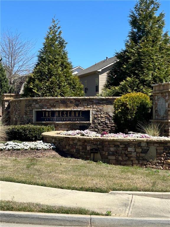 5860 Stargazer Way Cumming, GA 30028 - Photo 2 of 36 a front view of a house with a yard