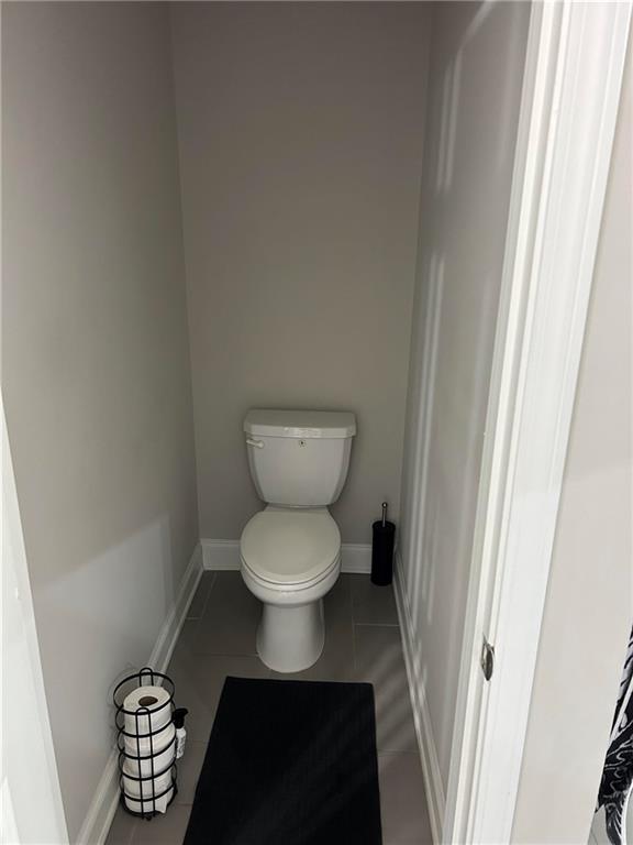 5860 Stargazer Way Cumming, GA 30028 - Photo 21 of 36 a bathroom with a toilet and a mirror