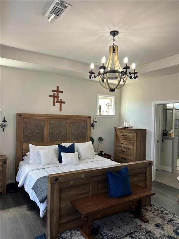 5860 Stargazer Way Cumming, GA 30028 - Photo 23 of 36 a bedroom with a bed and wooden floor