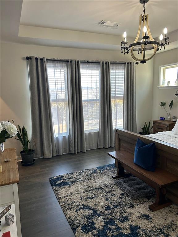5860 Stargazer Way Cumming, GA 30028 - Photo 24 of 36 a living room with furniture and a chandelier
