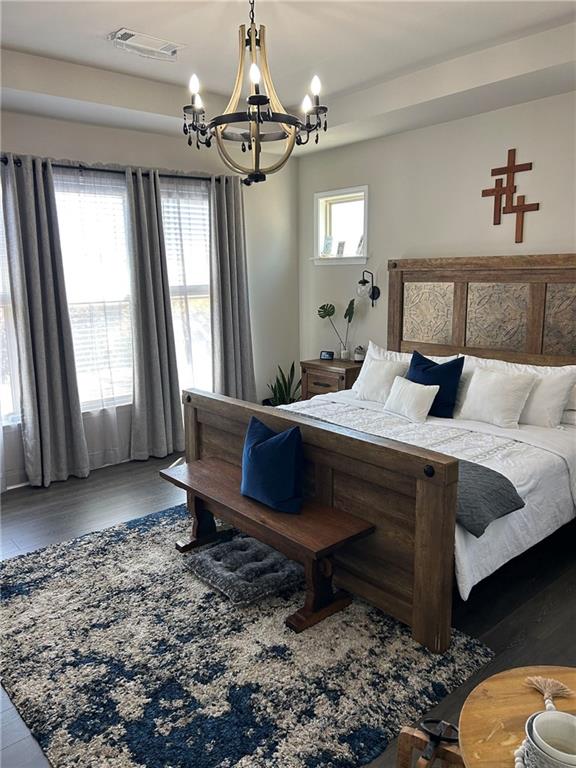 5860 Stargazer Way Cumming, GA 30028 - Photo 5 of 36 a bedroom with a bed lamp and a window