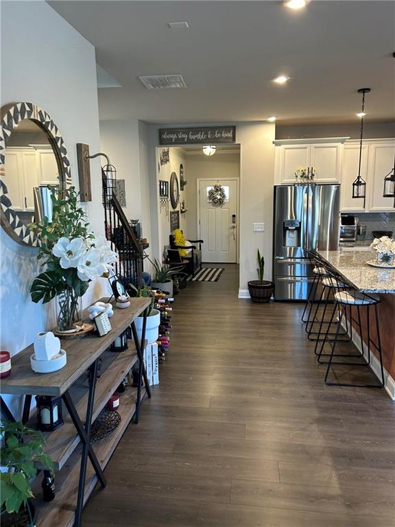 5860 Stargazer Way Cumming, GA 30028 - Photo 10 of 36 a living room with furniture and a wooden floor