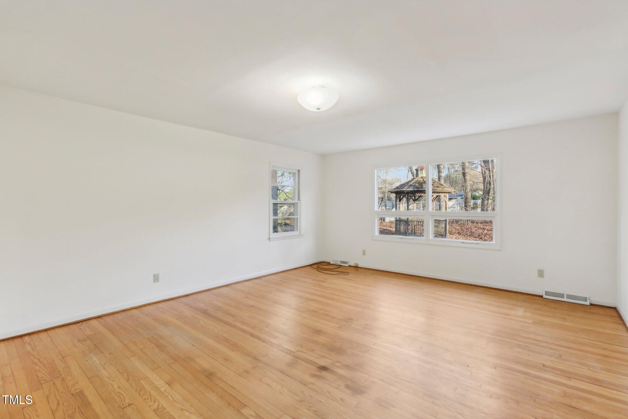 209 High House Road Cary, NC 27513 - Photo 12 of 40 an empty room with windows