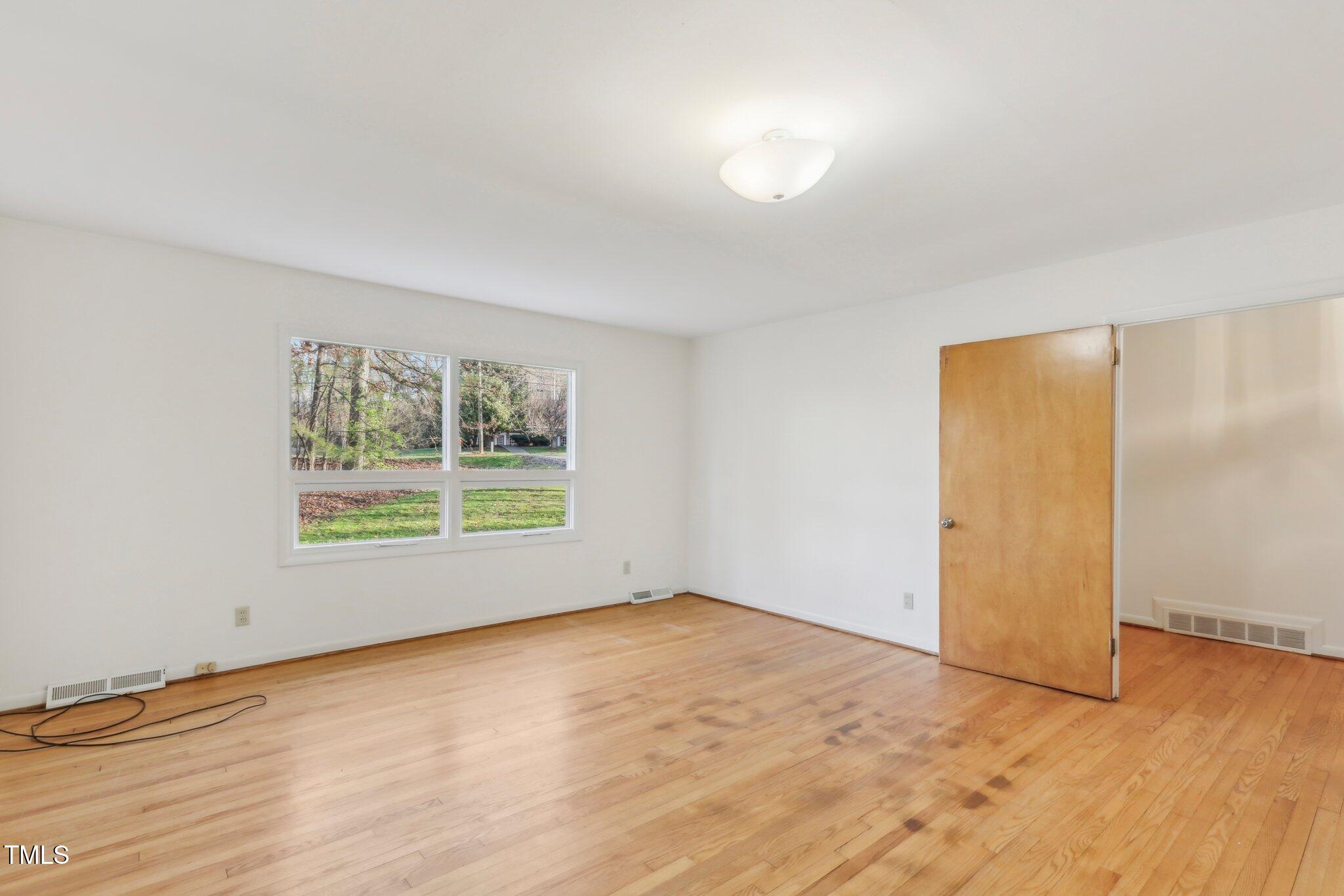 209 High House Road Cary, NC 27513 - Photo 2 of 40 a view of an empty room with a window
