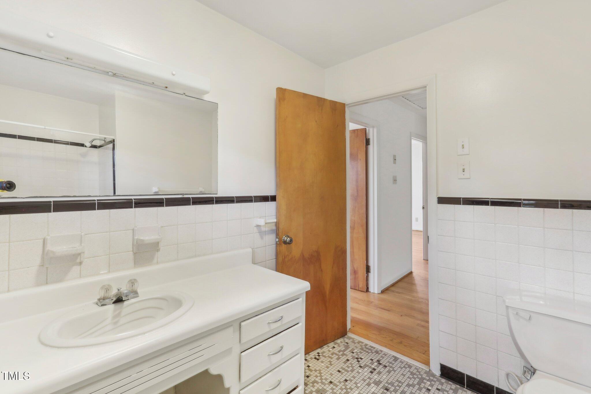 209 High House Road Cary, NC 27513 - Photo 21 of 40 a bathroom with a sink and a shower