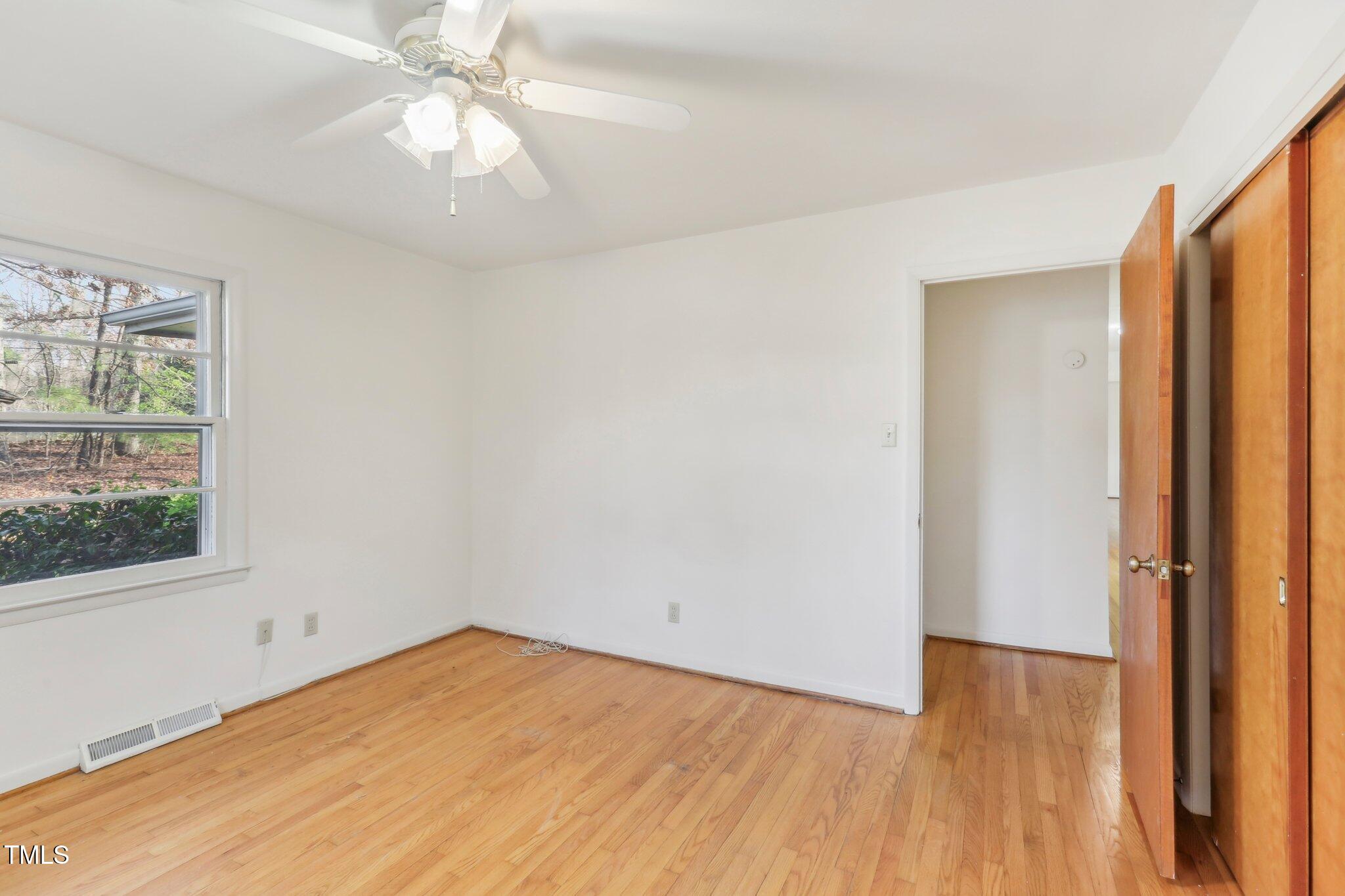 209 High House Road Cary, NC 27513 - Photo 25 of 40 wooden floor in an empty room with a window