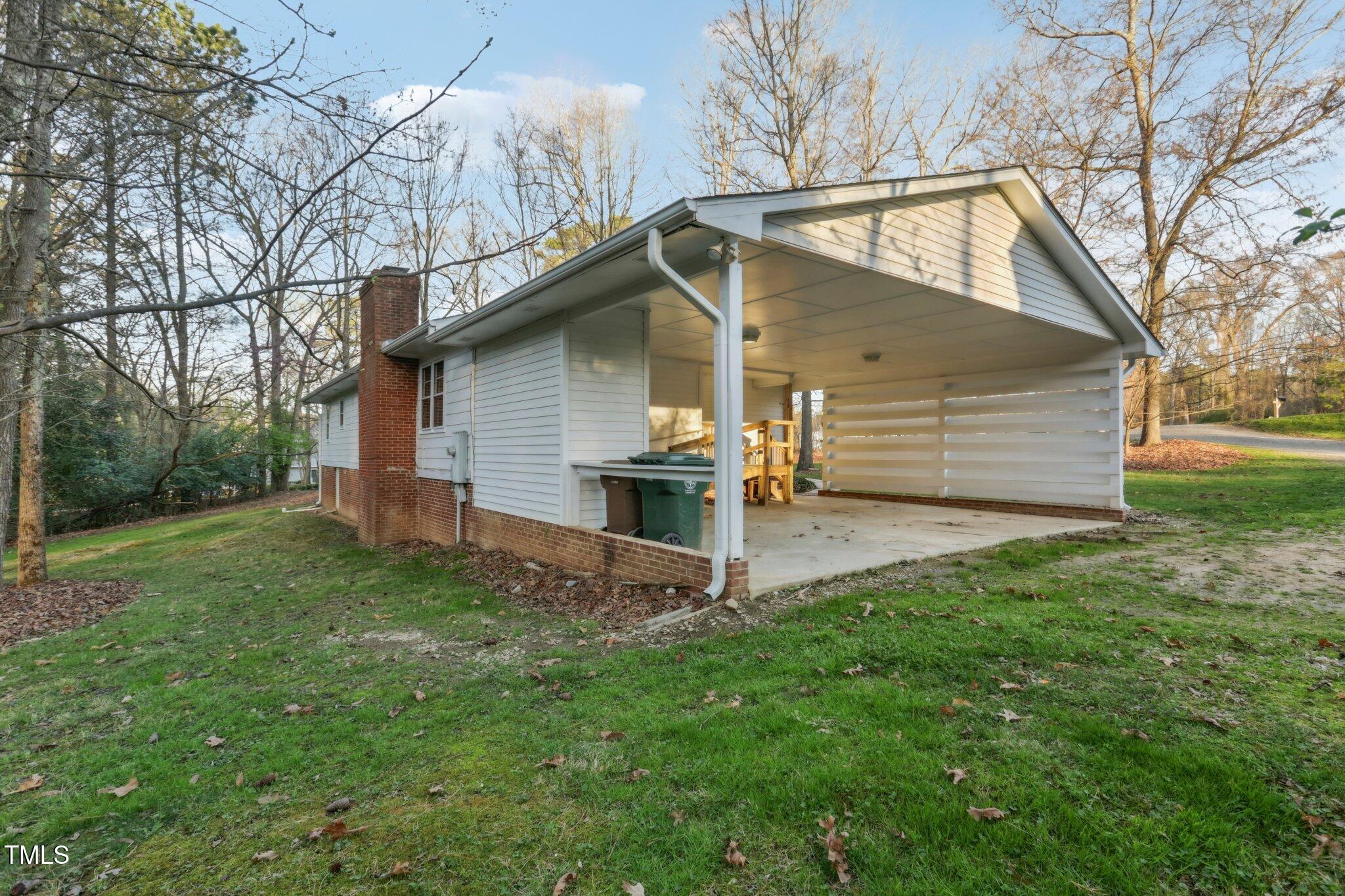 209 High House Road Cary, NC 27513 - Photo 33 of 40 a view of a house with a yard