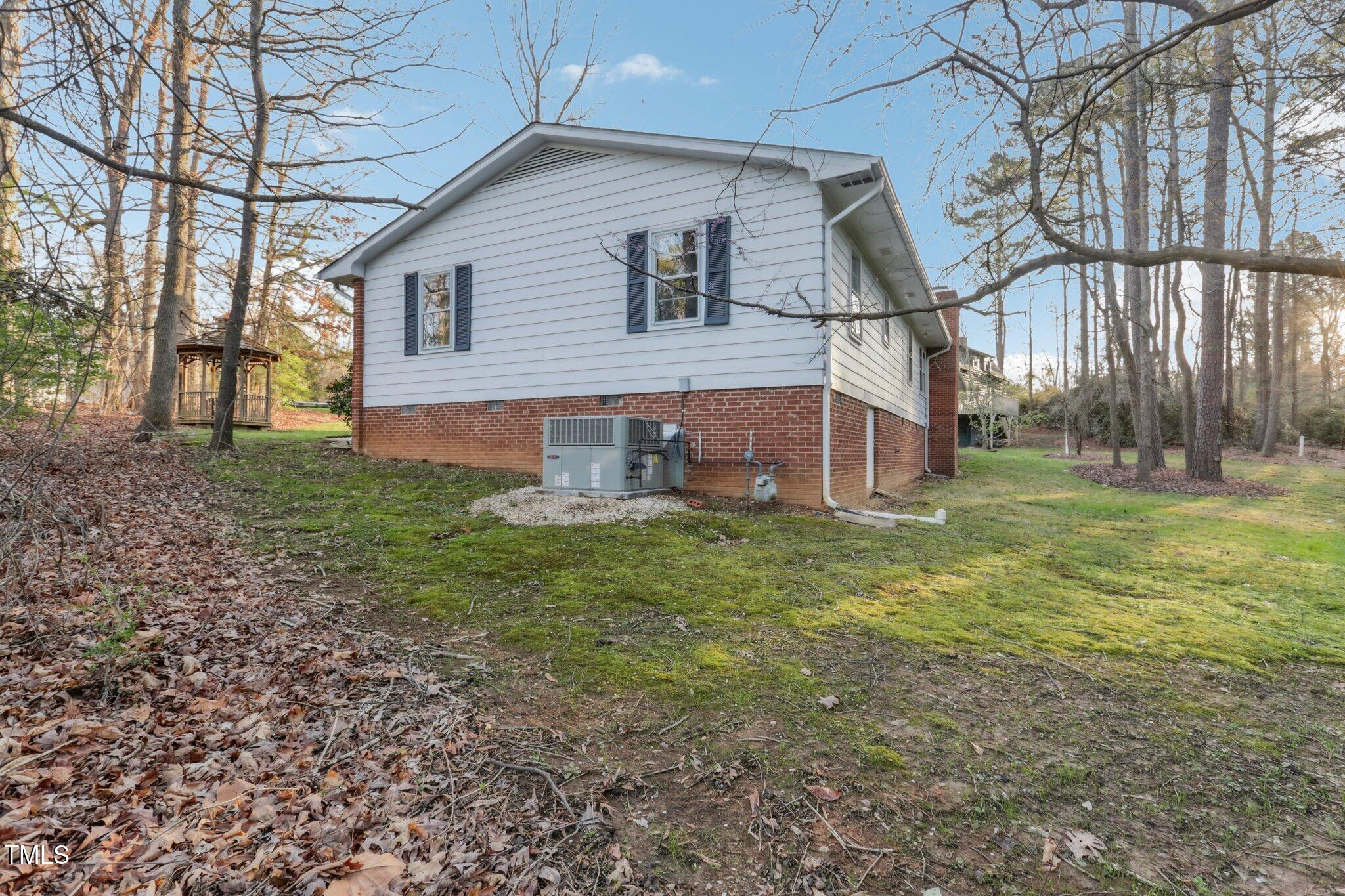 209 High House Road Cary, NC 27513 - Photo 35 of 40 a front view of house with small garden
