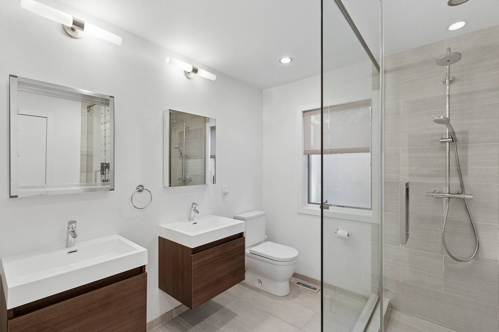 4 Bayberry Lane Remsenburg, NY 11960 - Photo 16 of 29 a bathroom with a double vanity sink toilet and shower
