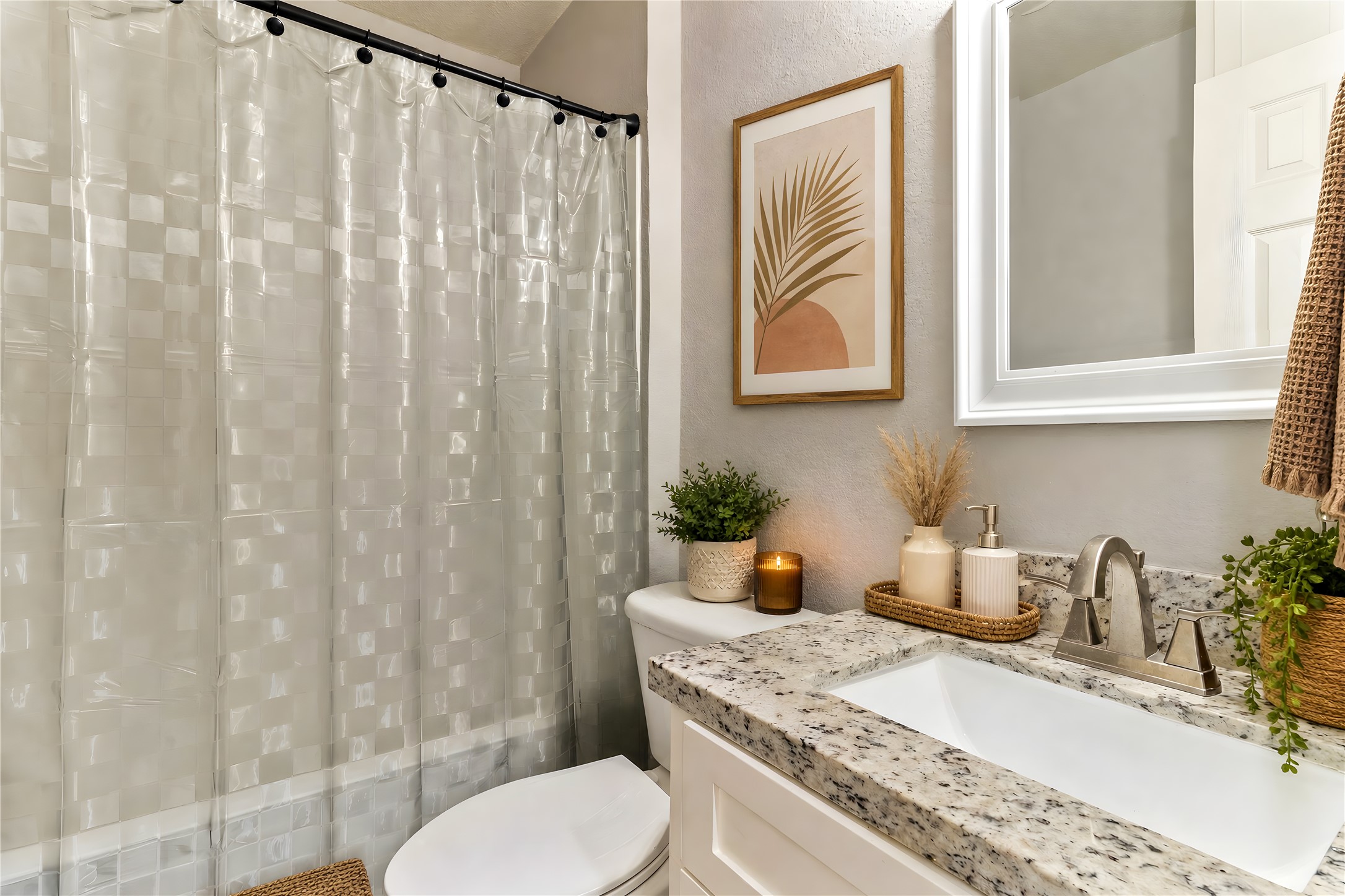117 Cannon Street Clute, TX 77531 - Photo 17 of 24 2nd full bath with tub/shower combo, updated vanity, framed mirror and bright neutral finishes.