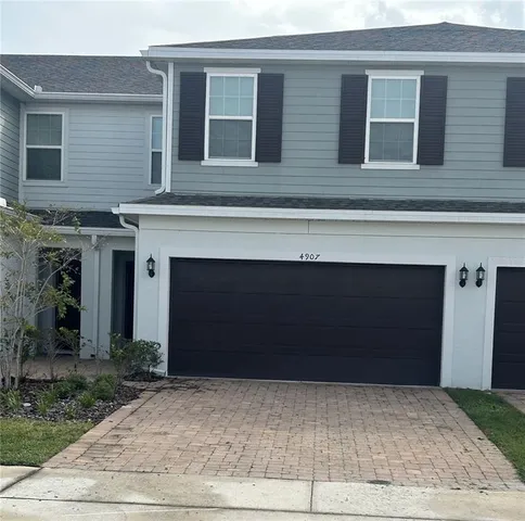 a front view of a house with yard