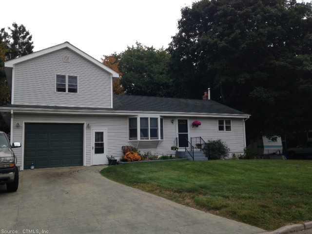 3 MacKenzie Road Waterford, CT 06385 - Photo 1 of 1 a front view of a house with a garden and porch