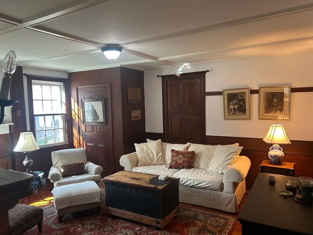 a living room with furniture window and a couch