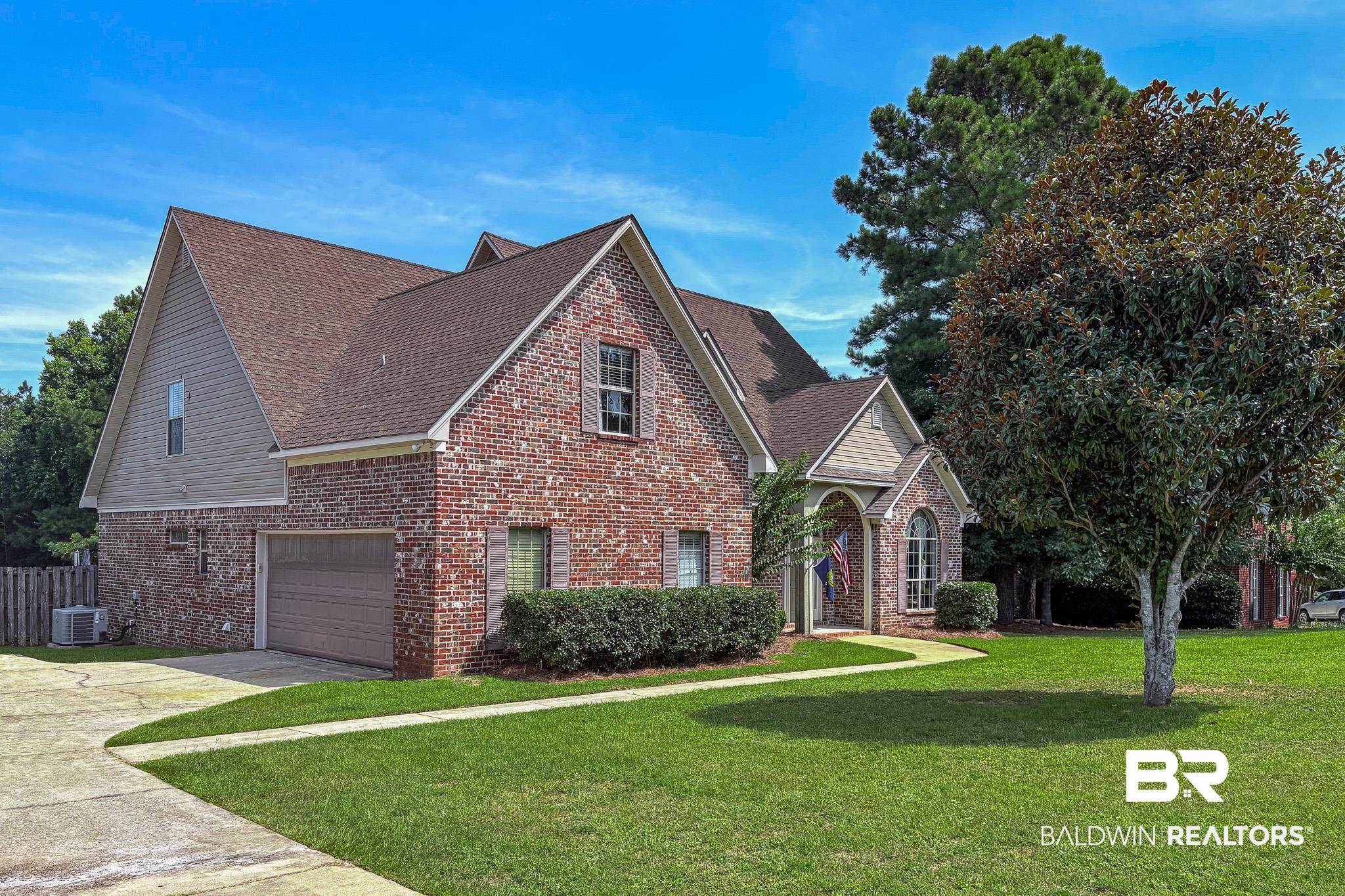 8421 Weatherford Court Daphne, AL 36527 - Photo 2 of 36 Traditional-style home with brick siding, driveway, a shingled roof, and an attached garage