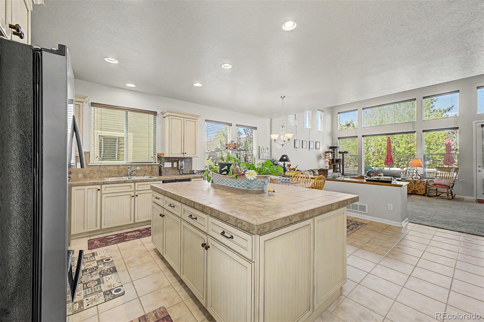 3343 Fantasy Place Castle Rock, CO 80109 - Photo 11 of 50 a kitchen with white cabinets and sink