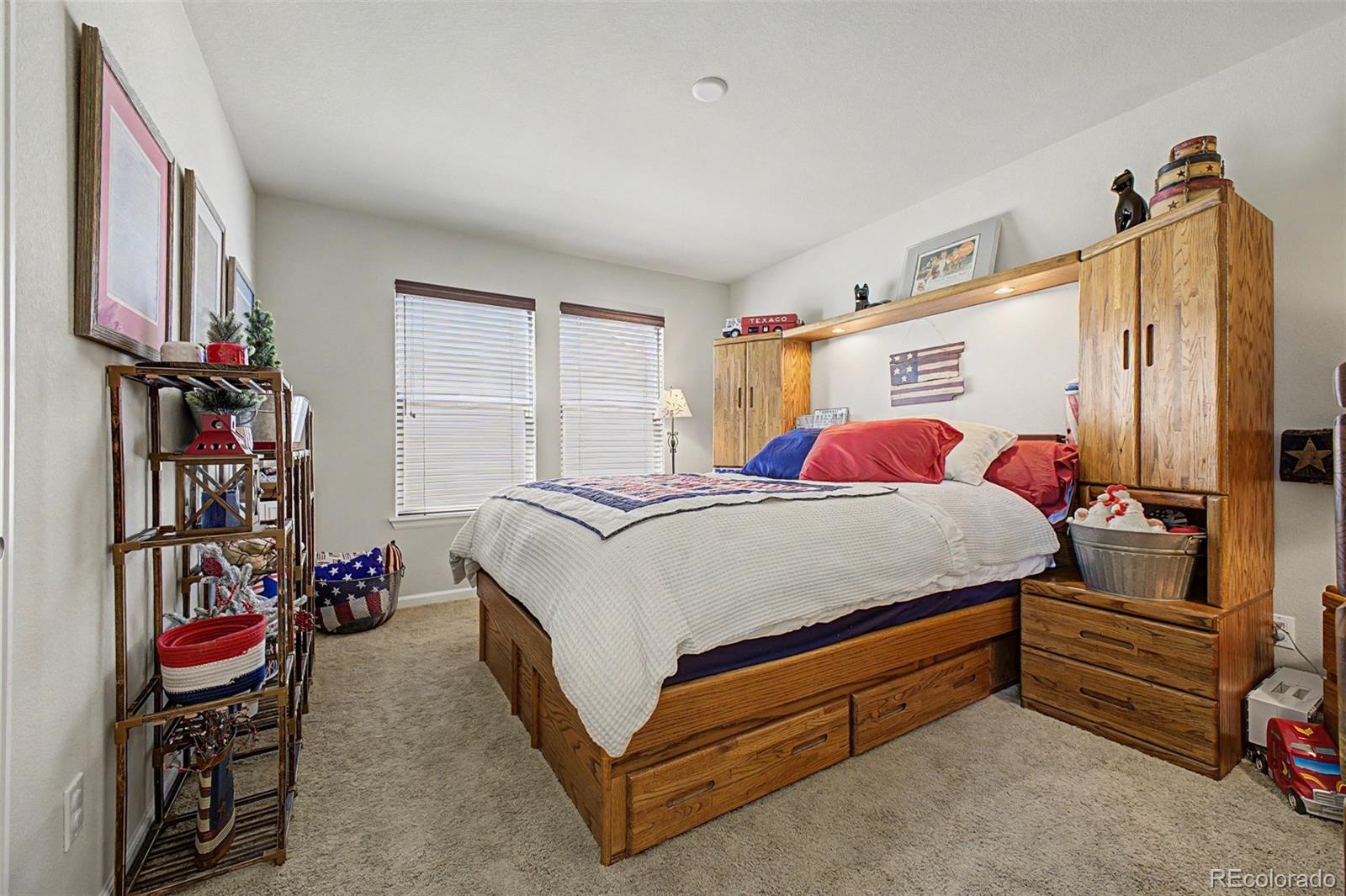 3343 Fantasy Place Castle Rock, CO 80109 - Photo 21 of 50 a bedroom with a bed closet and a window