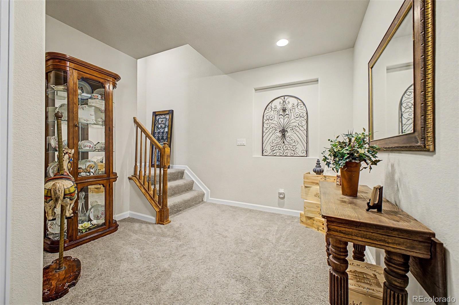 3343 Fantasy Place Castle Rock, CO 80109 - Photo 28 of 50 a view of front door with a table and a chair
