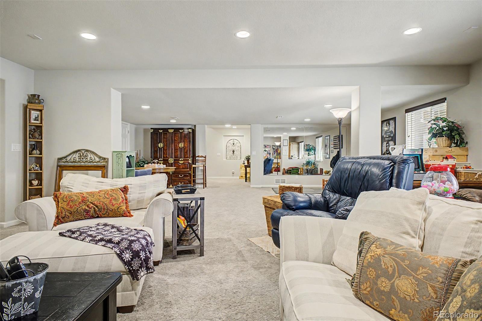 3343 Fantasy Place Castle Rock, CO 80109 - Photo 29 of 50 a living room with furniture and a couch