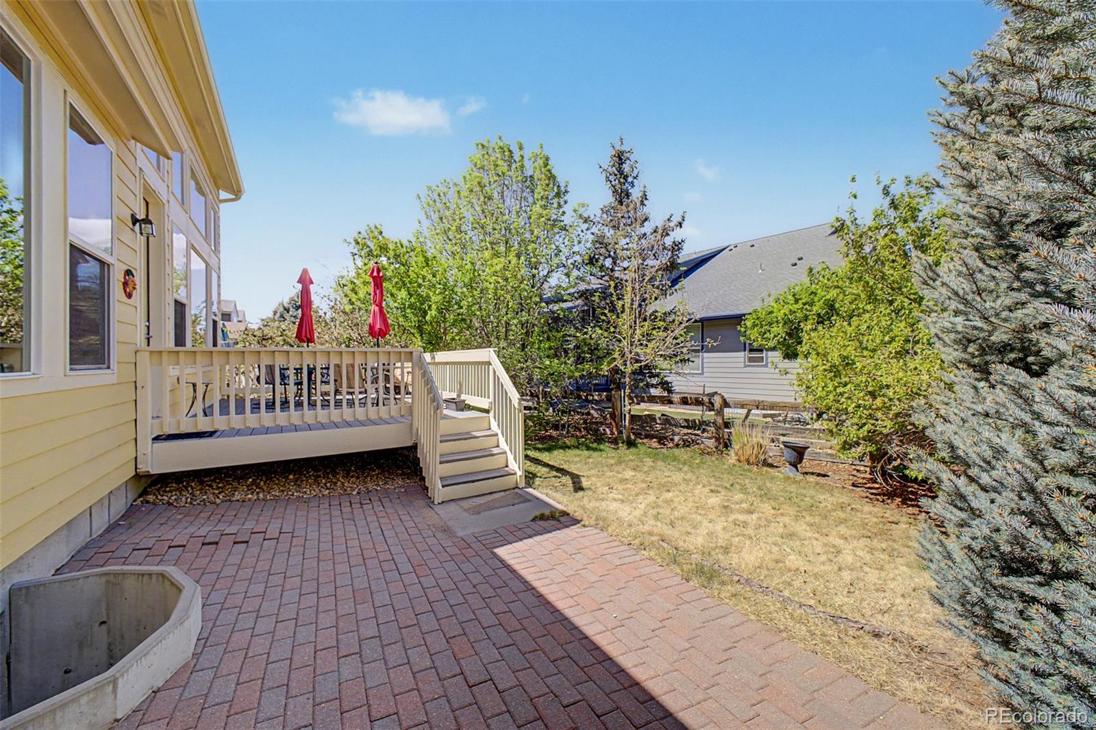 3343 Fantasy Place Castle Rock, CO 80109 - Photo 36 of 50 a view of a porch with furniture and a yard