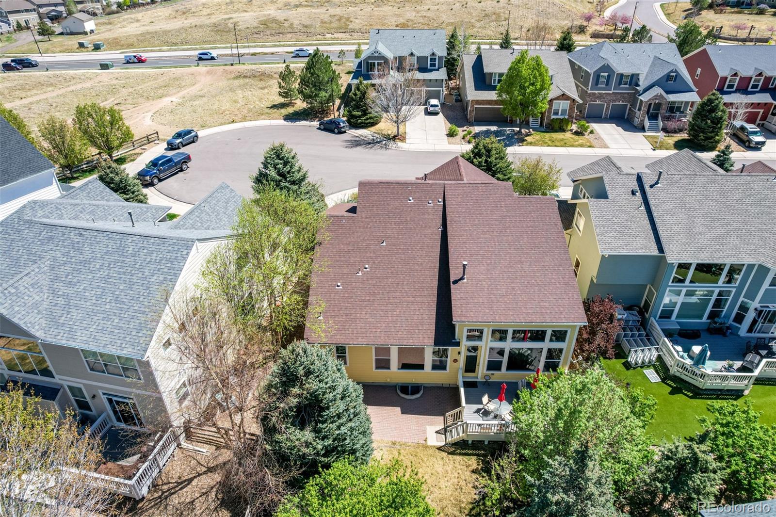 3343 Fantasy Place Castle Rock, CO 80109 - Photo 45 of 50 an aerial view of a house with a yard and lake view