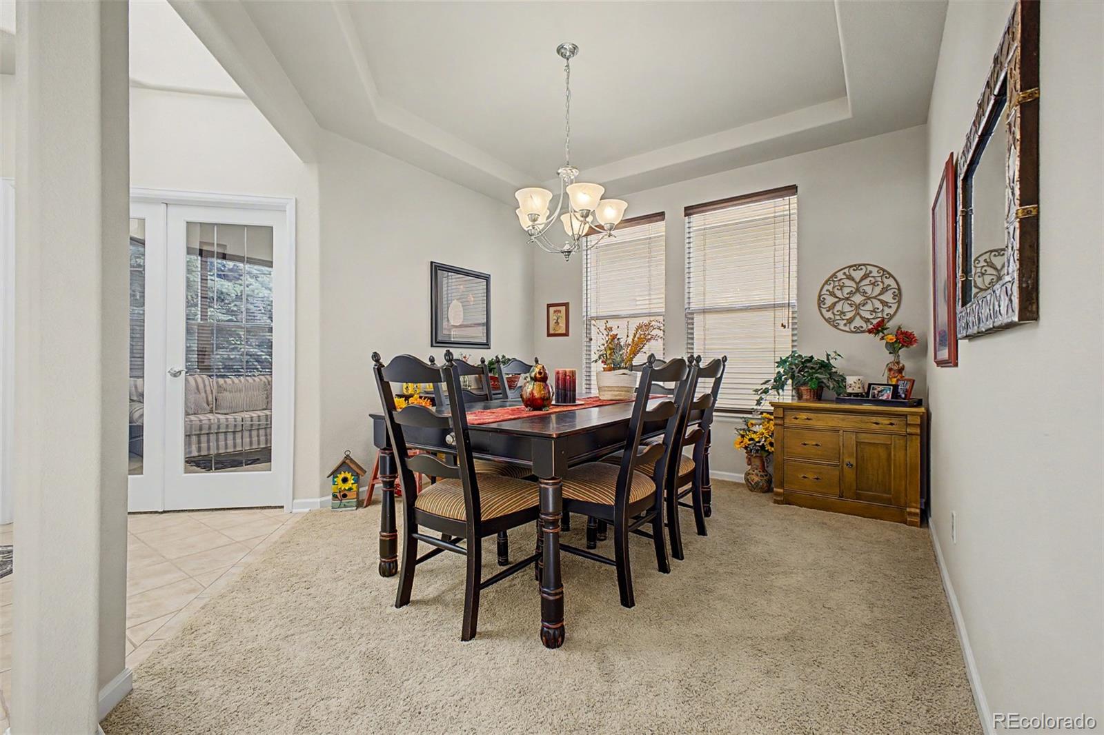 3343 Fantasy Place Castle Rock, CO 80109 - Photo 7 of 50 a view of a dining room with furniture and a chandelier