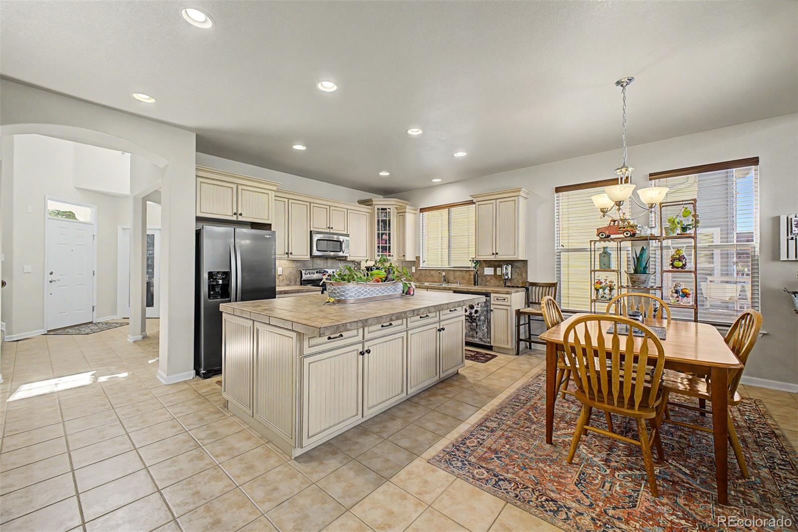 3343 Fantasy Place Castle Rock, CO 80109 - Photo 9 of 50 a kitchen with a cabinets and chairs