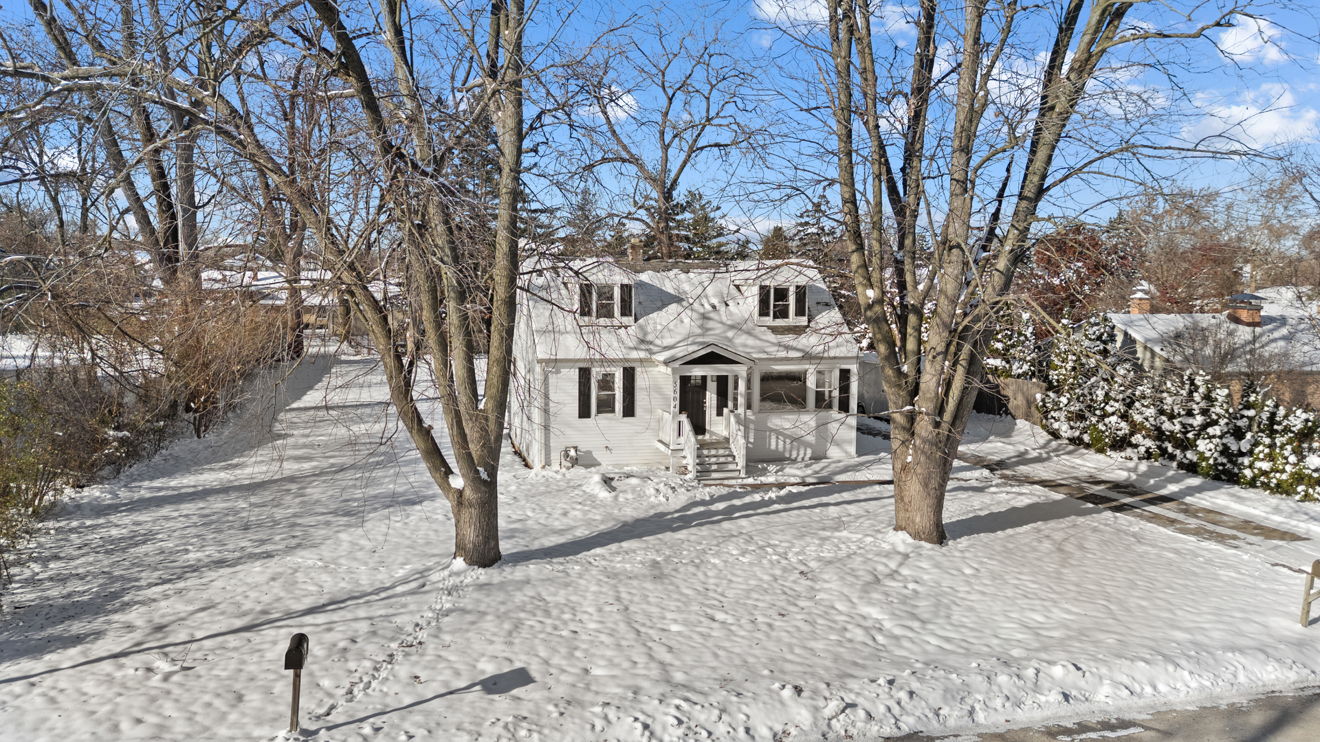 5604 South Madison Avenue Countryside, IL 60525 - Photo 1 of 38 a view of a building with large trees