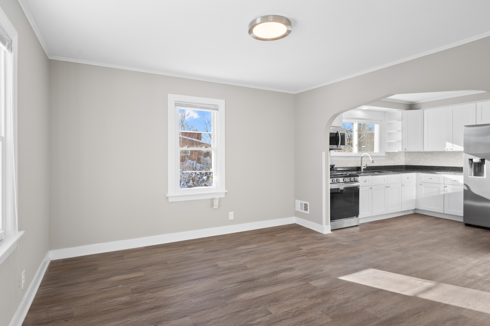 5604 South Madison Avenue Countryside, IL 60525 - Photo 7 of 38 an empty room with wooden floor and windows
