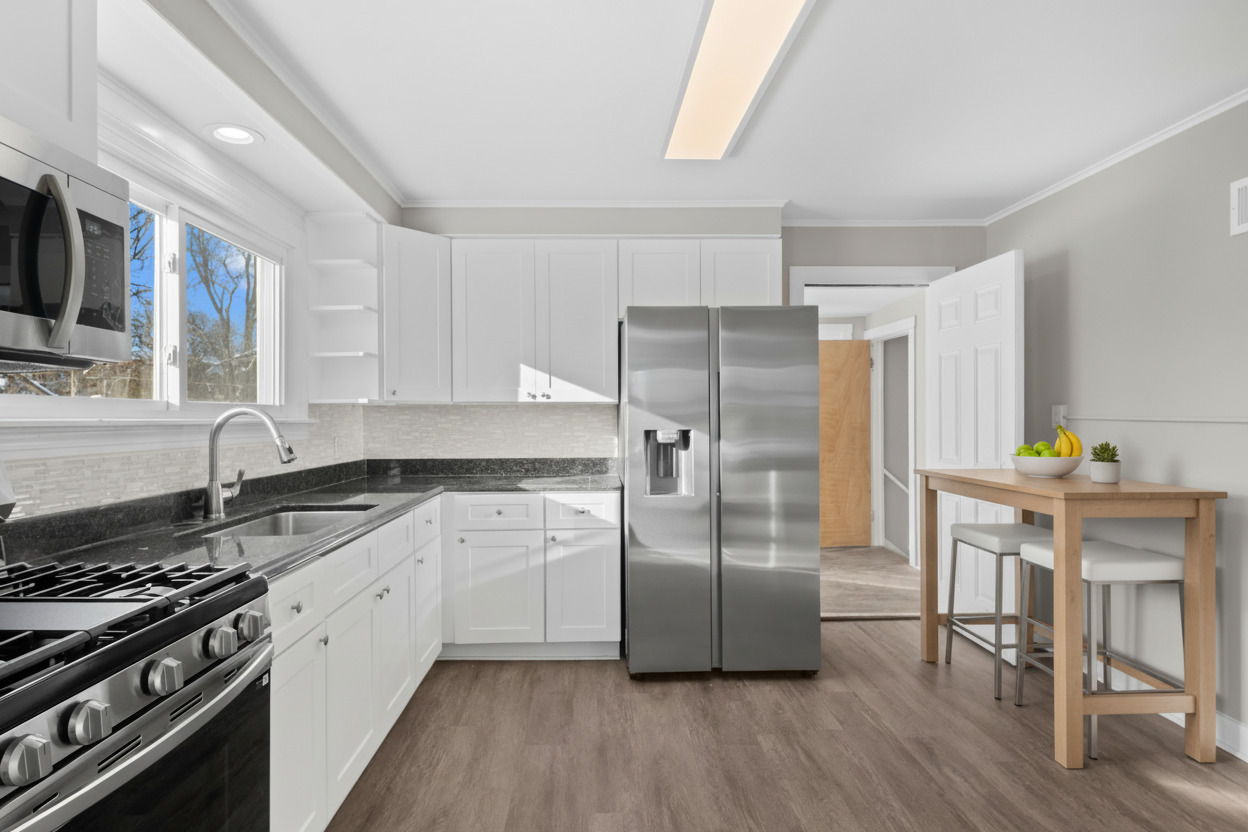 5604 South Madison Avenue Countryside, IL 60525 - Photo 9 of 38 a kitchen with granite countertop a refrigerator stove and sink