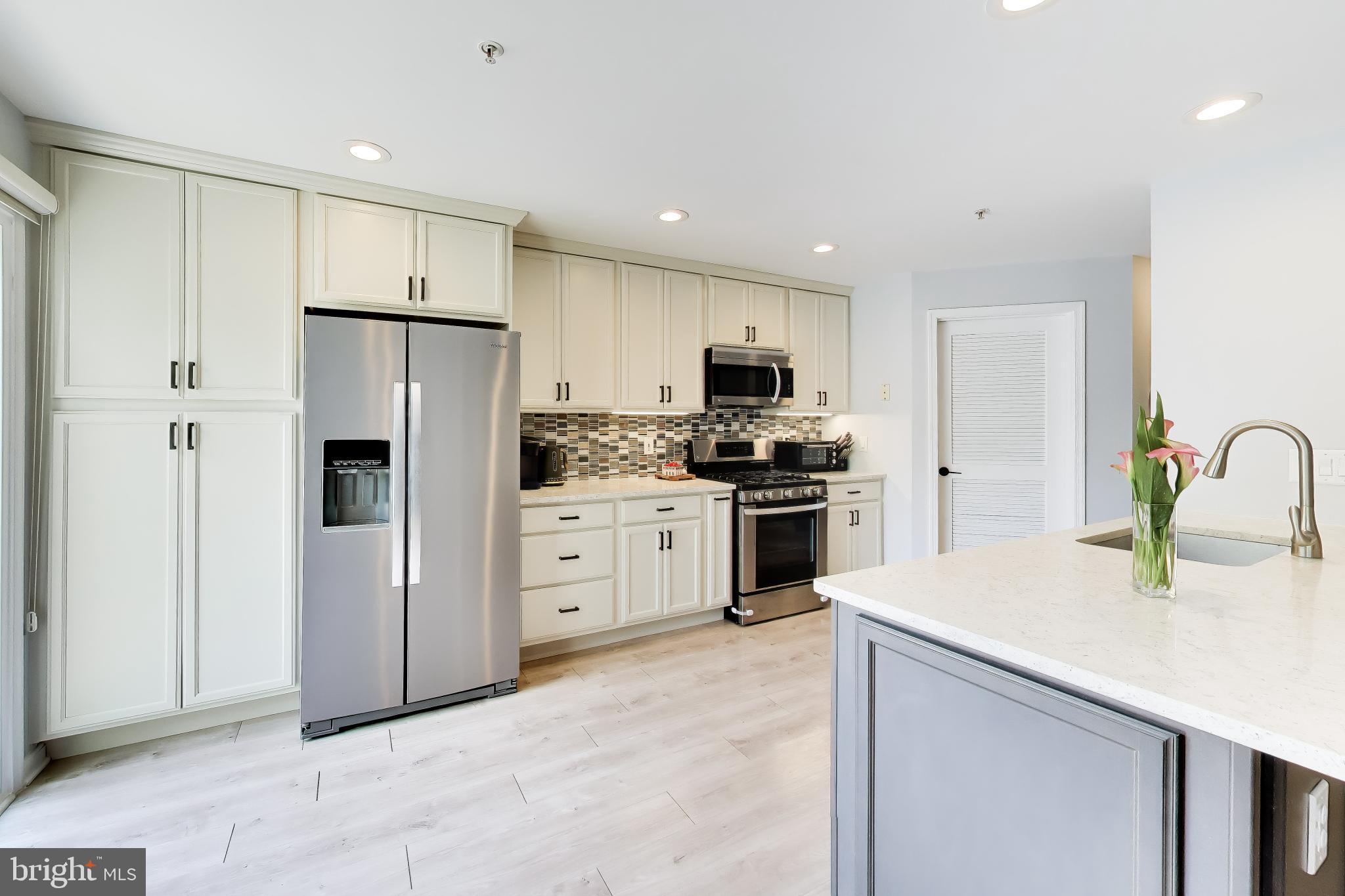 11830 Breton Court, Unit 23B Reston, VA 20191 - Photo 1 of 43 Modern kitchen with sleek finishes.
