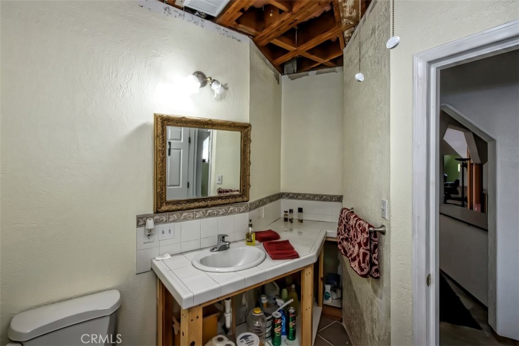 45985 Cottonwood Road Newberry Springs, CA 92365 - Photo 19 of 67 a bathroom with a sink and a mirror
