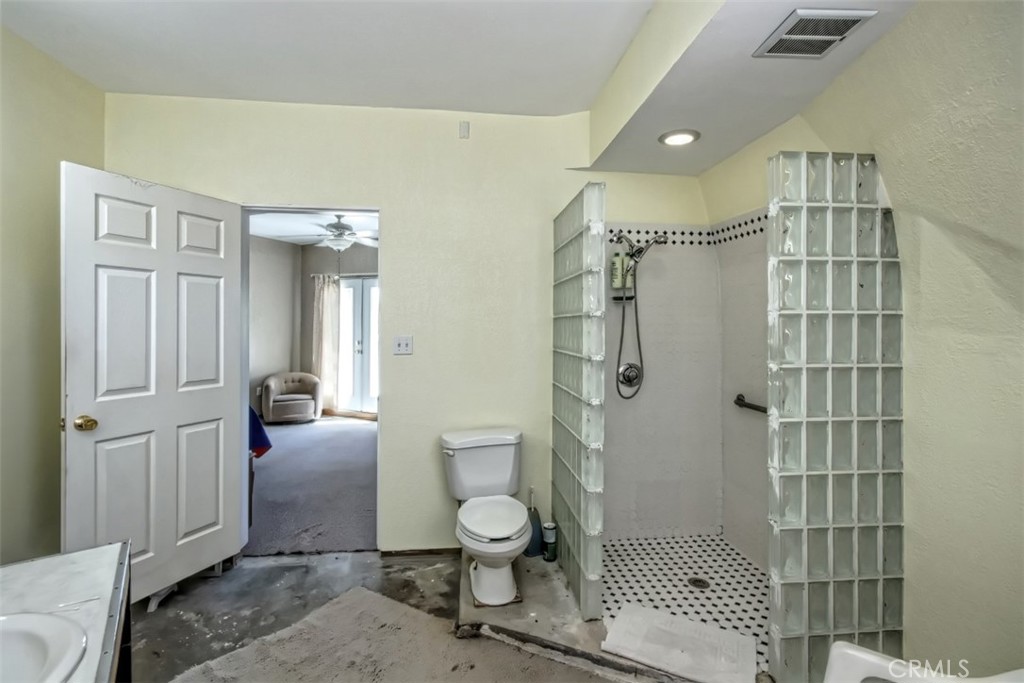 45985 Cottonwood Road Newberry Springs, CA 92365 - Photo 27 of 67 a bathroom with a shower toilet and a sink