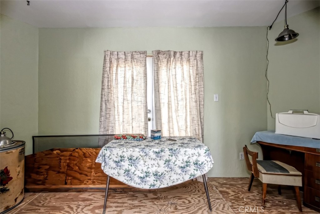 45985 Cottonwood Road Newberry Springs, CA 92365 - Photo 32 of 67 a living room with a couch and a table