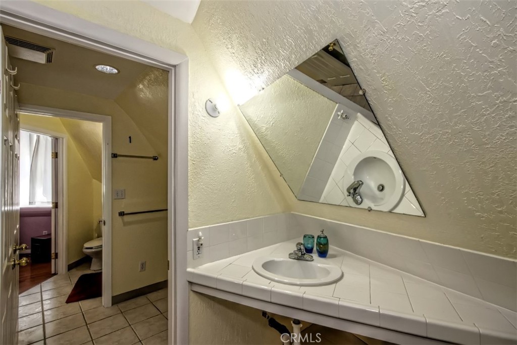 45985 Cottonwood Road Newberry Springs, CA 92365 - Photo 37 of 67 a bathroom with a sink vanity and a mirror