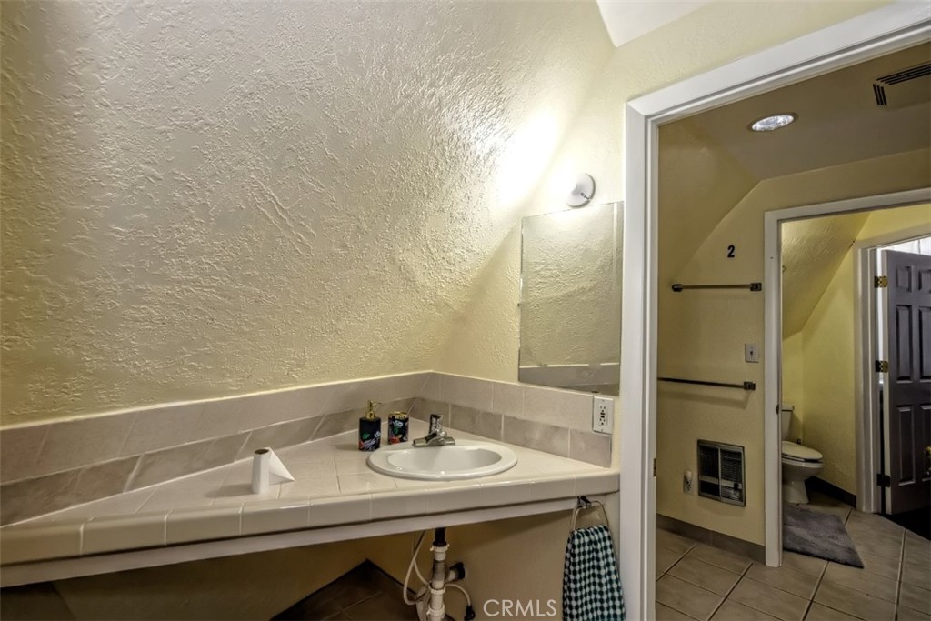 45985 Cottonwood Road Newberry Springs, CA 92365 - Photo 38 of 67 a bathroom with a sink and a mirror
