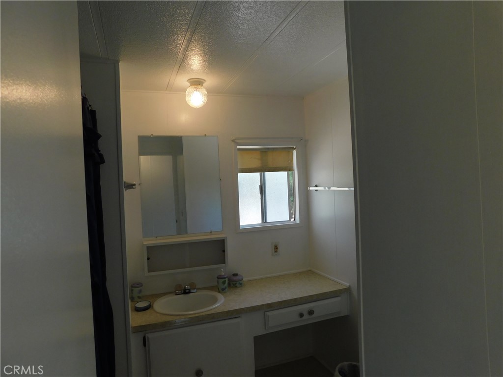 45985 Cottonwood Road Newberry Springs, CA 92365 - Photo 54 of 67 a bathroom with a sink and a mirror
