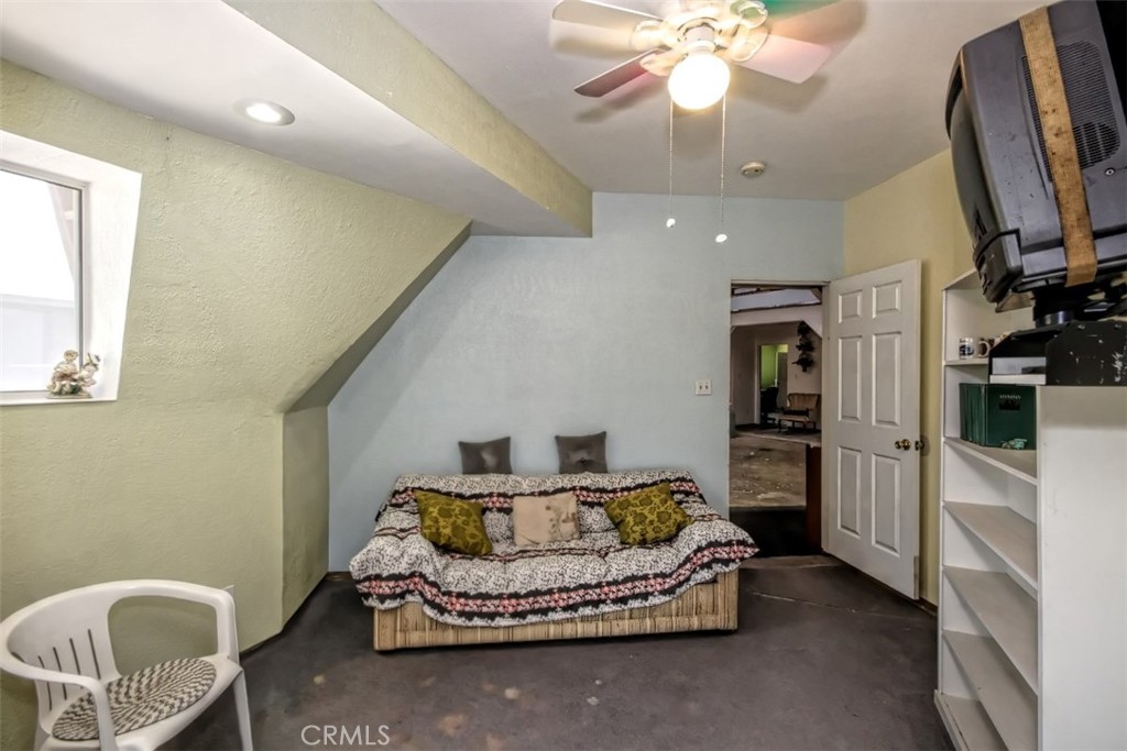 45985 Cottonwood Road Newberry Springs, CA 92365 - Photo 10 of 67 a living room with furniture and a flat screen tv