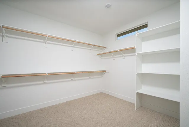 a view of an empty walk in closet