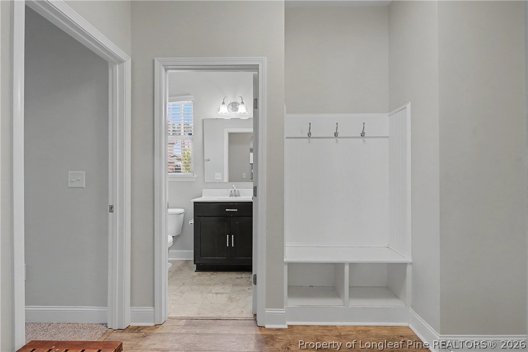 47 Pinnacle Drive Spring Lake, NC 28390 - Photo 17 of 50 a bathroom with a glass shower door and a sink